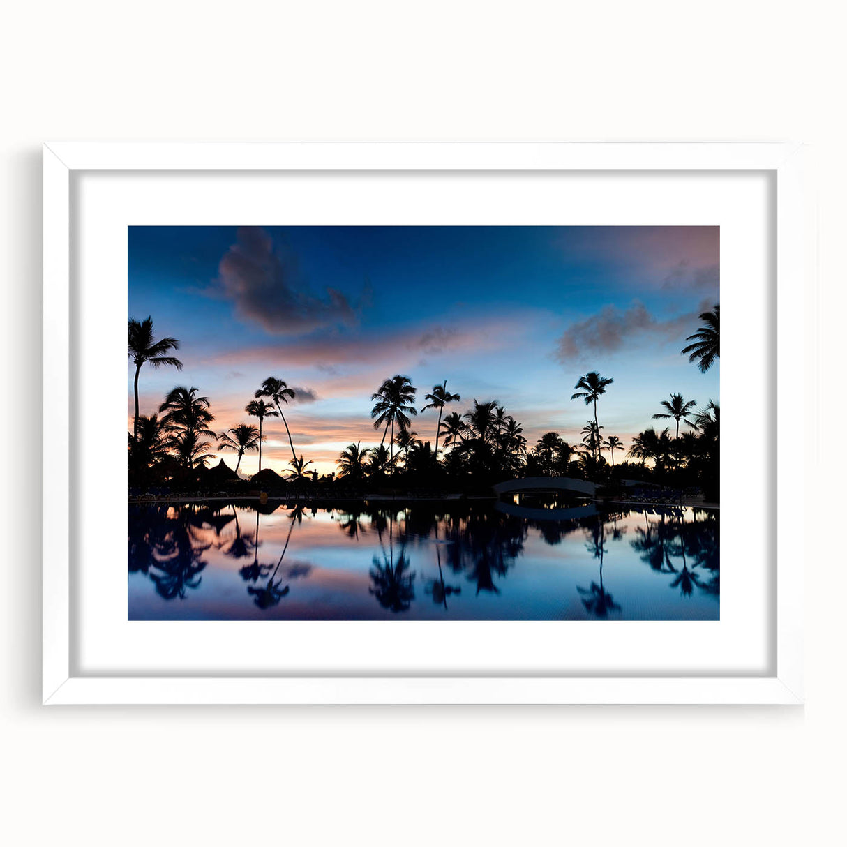 Textured abstract art print depicting a Caribbean scenery in vibrant blue and green tones, framed with a white mat.