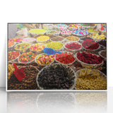 Large acrylic print of a Caribbean scenery in mid-century modernist style, with vibrant blue and green hues, framed in white.