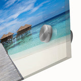 Large abstract wall art depicting a Caribbean scenery in vibrant blues and greens on acrylic glass.