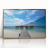 Mid-century modernist art depicting a Caribbean scenery in muted gold and blue tones on a framed acrylic print.