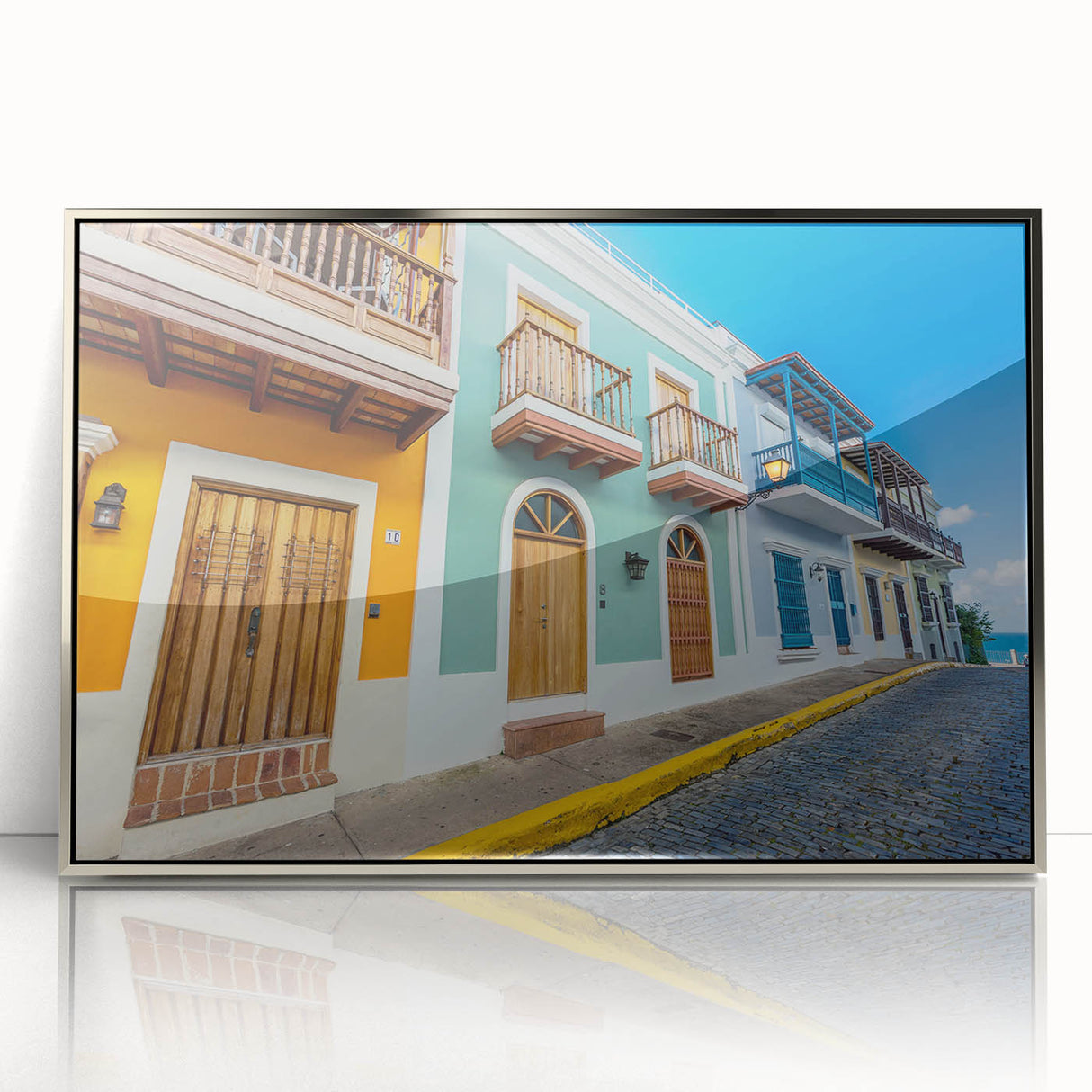 Acrylic print of a Caribbean Puerto Rican scenery in silver frame, featuring vibrant ocean blues and greens.