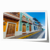 Rolled print of a Caribbean landscape with lush greenery and ocean backdrop, suitable for art wall dining room.