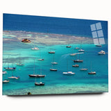 Large abstract wall art of a Caribbean beach scene in vibrant blue and turquoise tones on acrylic glass.