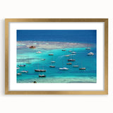 Abstract art print of Caribbean scenery in muted blue and green tones on a framed canvas, suitable for dining room decor.