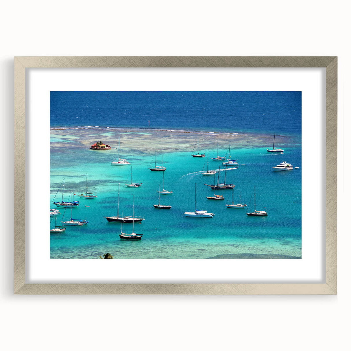 Extra large abstract art print of Caribbean scenery in muted blue and green tones on a framed canvas.