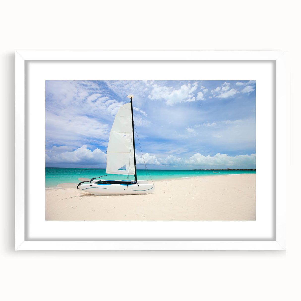 Abstract art print of Caribbean scenery in vibrant blue and green tones, framed with a white mat.