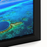 Extra large framed canvas featuring a textured depiction of a Central American scenery in black with colorful accents.