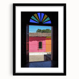 Extra large abstract art print of a vibrant, colorful Central American landscape on a textured canvas, framed in black.