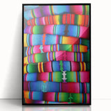Large abstract wall art of a Central American landscape in muted earth tones, framed in black acrylic.