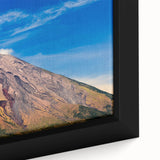 Close-up of a framed canvas depicting a black textured art scene from Central America, with vibrant, colorful accents.