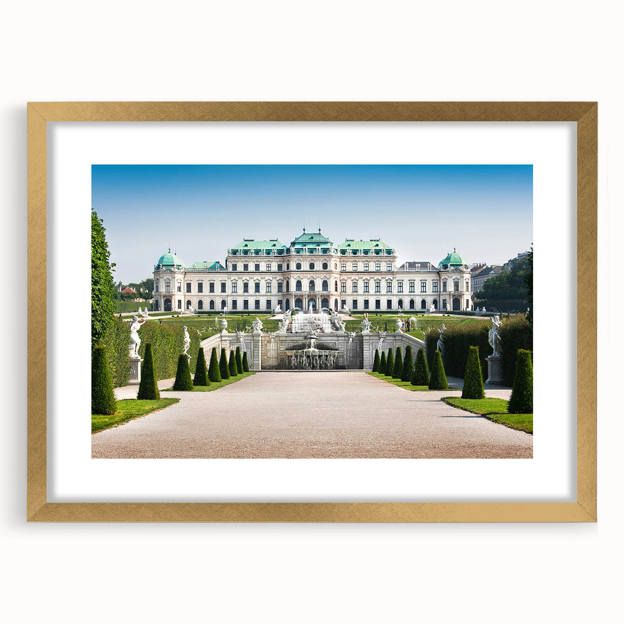 Abstract art print of a European landscape in muted gold and green tones, framed with a golden mat.