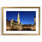 Abstract art print depicting a European scenery in muted gold and green tones, framed with a mat.