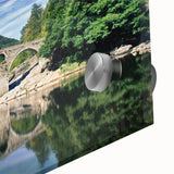 Large abstract wall art depicting a European scenery in muted earth tones on acrylic glass.