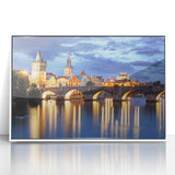 Mid-century modernist art depicting Prague skyline in muted gray, acrylic print framed in white.