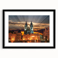 Abstract art print of a colorful European cityscape in vibrant hues, framed in black, ideal for living room decor.