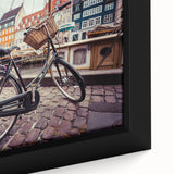 Framed canvas depicting a textured, colorful European scenery in black with vibrant accents, ideal for living room decor.