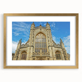 Abstract art print of the Bath, England skyline in muted gold and blue tones on a framed canvas, ideal for dining room decor.