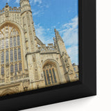 Framed canvas of a textured European cityscape in black with colorful accents, ideal for large living room walls.