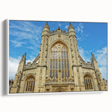 Framed canvas of vintage poster art depicting the cityscape of Bath, England, in vibrant colors, ideal for living room decor.