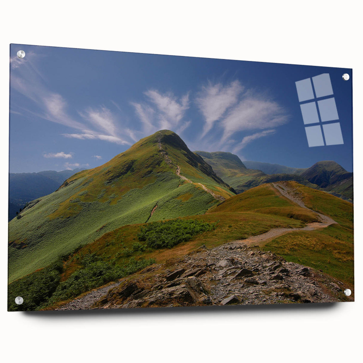 Acrylic print of a Cumbria, England landscape with lush green fields and distant hills, ideal for dining room decor.