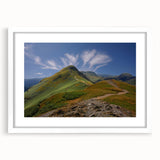 Textured art print of an abstract Cumbria landscape in muted earth tones, framed with a white mat, ideal for bedroom decor.