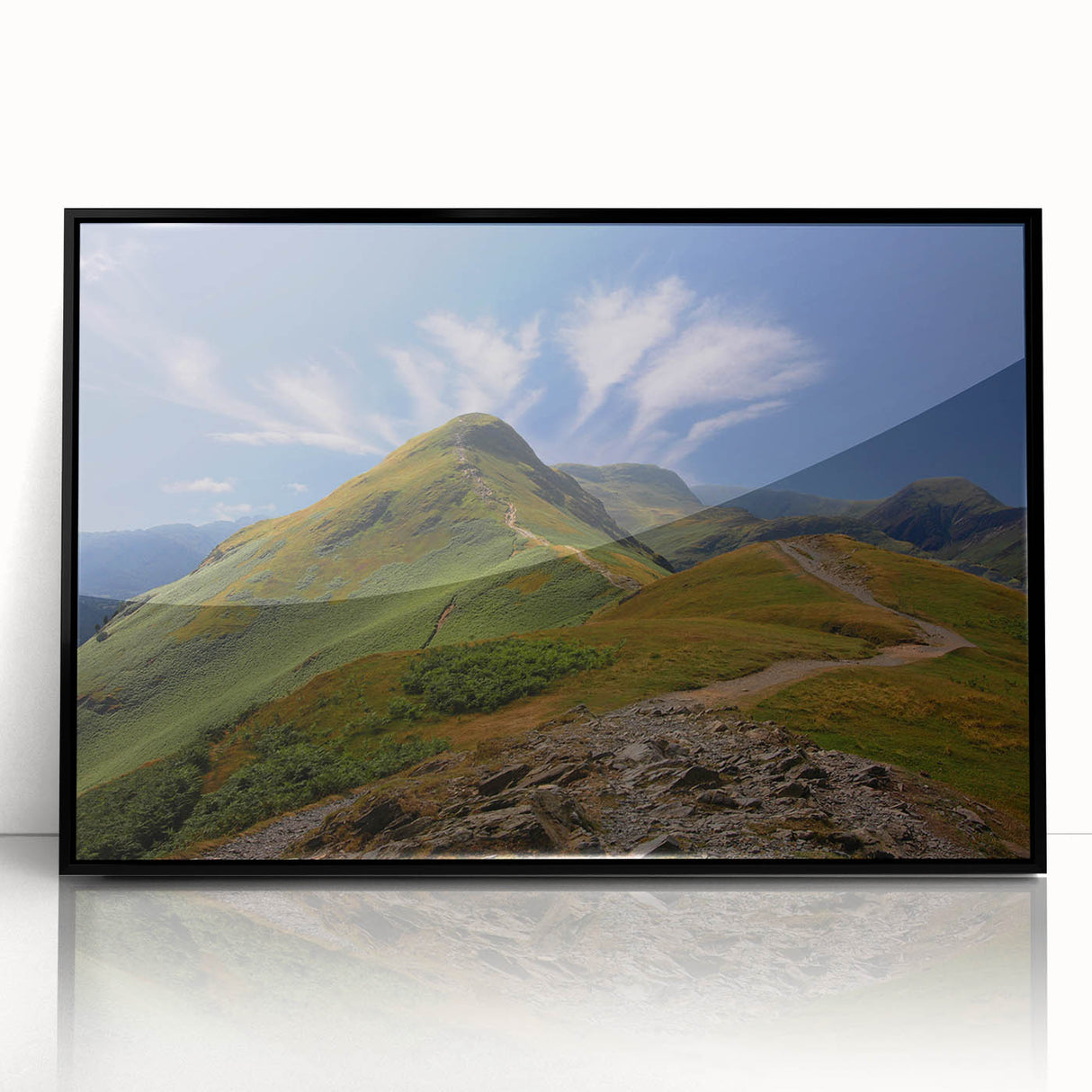 Large abstract wall art depicting a stylized Cumbrian landscape in muted earth tones, framed in black acrylic.