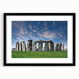 Extra large textured abstract print of Stonehenge in vibrant colors on a framed black mat, ideal for living room decor.