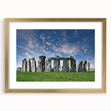 Abstract art print of Stonehenge in muted earth tones, framed in gold, ideal for dining room decor.