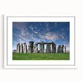 Textured art print of Stonehenge in muted earth tones on white-framed matte, ideal for bedroom art.