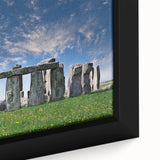 Black wall art featuring a close-up textured image of Stonehenge in muted gray tones on a framed canvas.