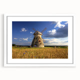 Abstract textured art print of a European scenery in muted earth tones on a white-framed mat, suitable for bedroom decor.