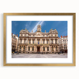 Abstract art print of Lyon scenery in muted gold and blue tones on a framed canvas, ideal for dining room decor.