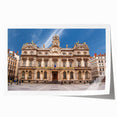 Rolled print of Lyon, France scenery with floral elements in soft hues.