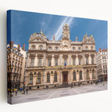 A large stretched canvas depicting a detailed scene of Lyon, France, with vibrant earth tones, ideal for kitchen wall art.