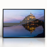 Large abstract wall art depicting a European scenery, in muted earth tones on a black framed acrylic.