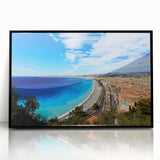 Large abstract wall art depicting a vibrant scene of Nice, France in mid-century modernist style, framed in black acrylic.