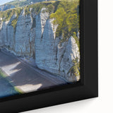 Extra large framed canvas featuring a textured depiction of a Normandy scenery in black with colorful accents.
