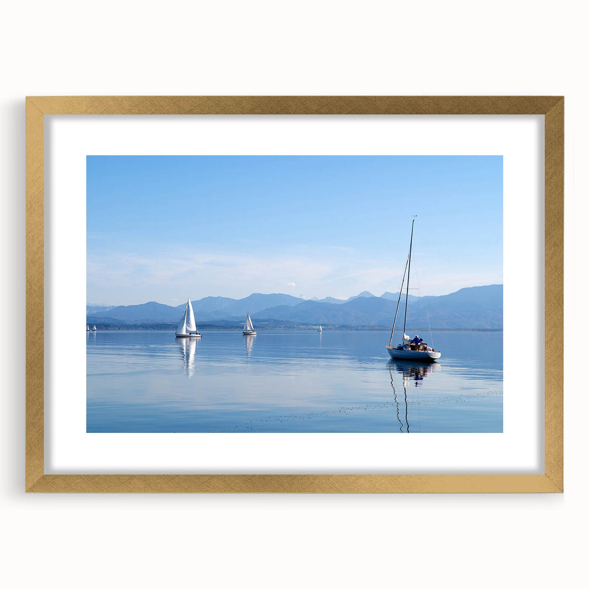 Abstract art print of a Bavarian landscape in muted green and blue tones, framed in gold, suitable for dining room decor.
