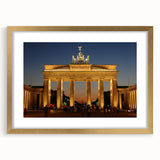 Abstract art print of Berlin skyline in muted gold and gray tones on a framed canvas.
