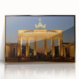Acrylic print of Berlin skyline with gold frame, featuring art deco style and muted colors.