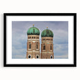 Abstract art print of Munich scenery in vibrant colors on a large textured canvas, framed in black.