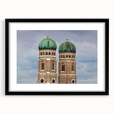 Abstract art print of Munich scenery in vibrant colors on a large textured canvas, framed in black.