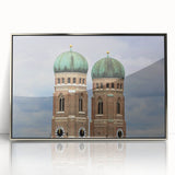 Mid-century modernist art of Munich skyline in muted blues and grays, acrylic print in silver frame.