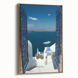 Framed canvas depicting the Santorini landscape in muted blue and white tones, suitable as wall art for a bedroom.