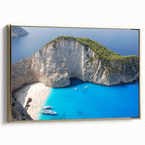 Framed canvas featuring a vintage-style landscape painting of a Greek scenery in muted gold and black tones.