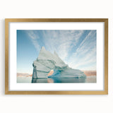 Abstract art print of a Greenland landscape in muted green and blue tones, framed in gold.