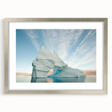 Extra large abstract art print of Greenland scenery in muted green and blue tones, framed in silver.
