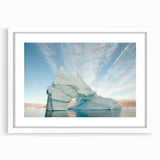 Textured abstract art print of Greenland scenery in muted green tones, framed with a white mat, ideal for bedroom art.