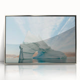 Large art print of a Greenlandic landscape in muted green and blue tones, framed in silver acrylic.