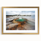 Abstract art print depicting a serene Icelandic landscape in cool blue and gray tones, framed in gold.